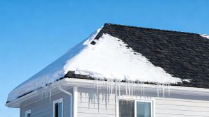 Snowy house with a safe, winter-ready roof.