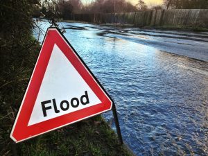 Texas flood sign, water rising in street