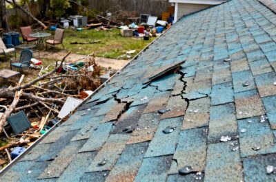 Cluttered property roof inspection for hail damage in Spring, TX.