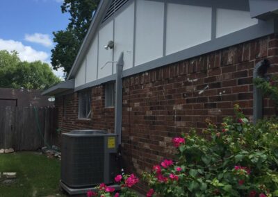 Updated exterior of a single-story brick home after renovation.