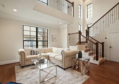 Restored living room after water damage cleanup, showing clean floors and finished interior.
