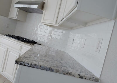 Clean, restored kitchen with dark cabinets and new appliances after hoarding cleanup.