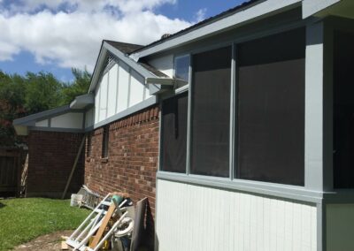 exterior patio enclosure restoration with new posts and roof framing